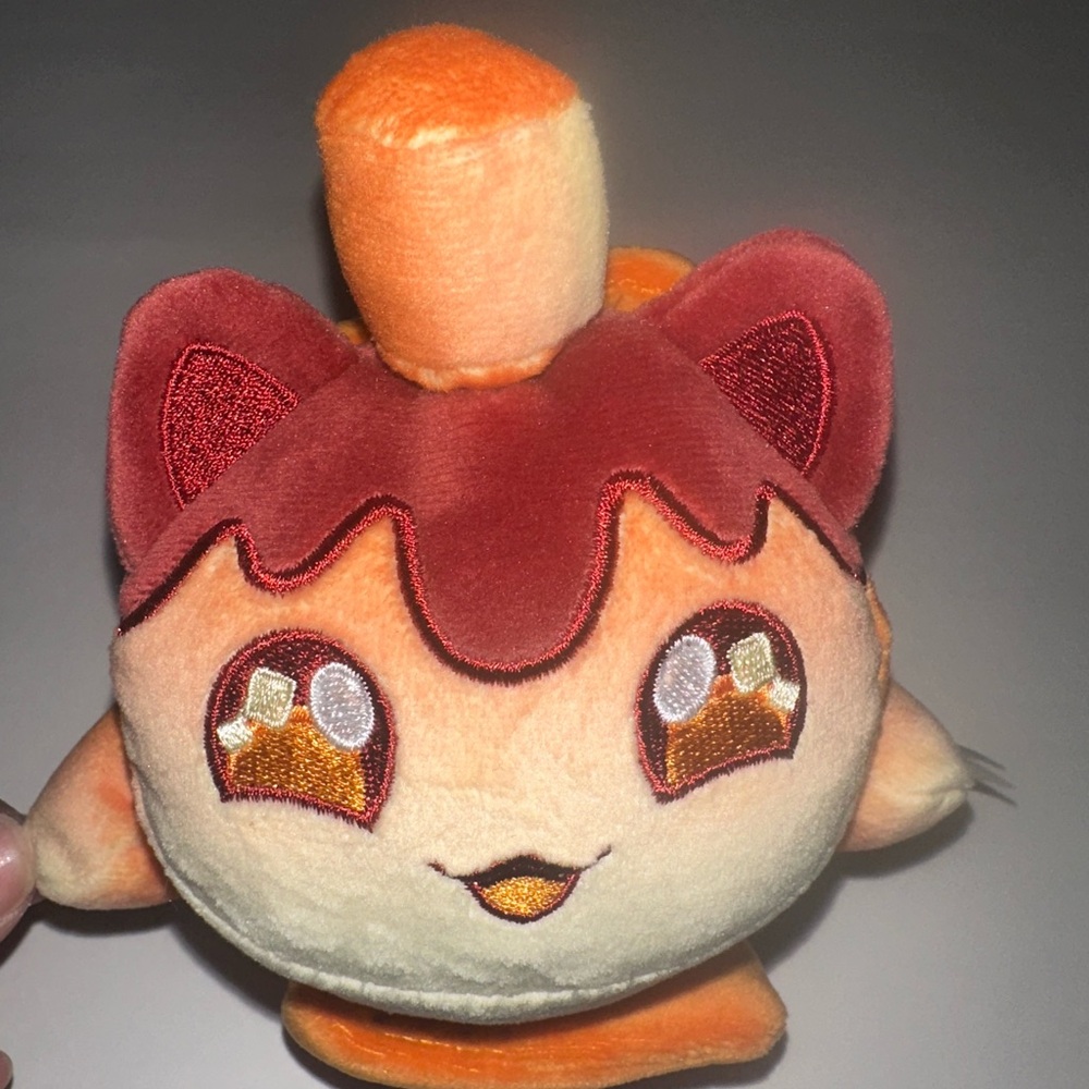 Plush Cat Toy with Orange and Red Accents